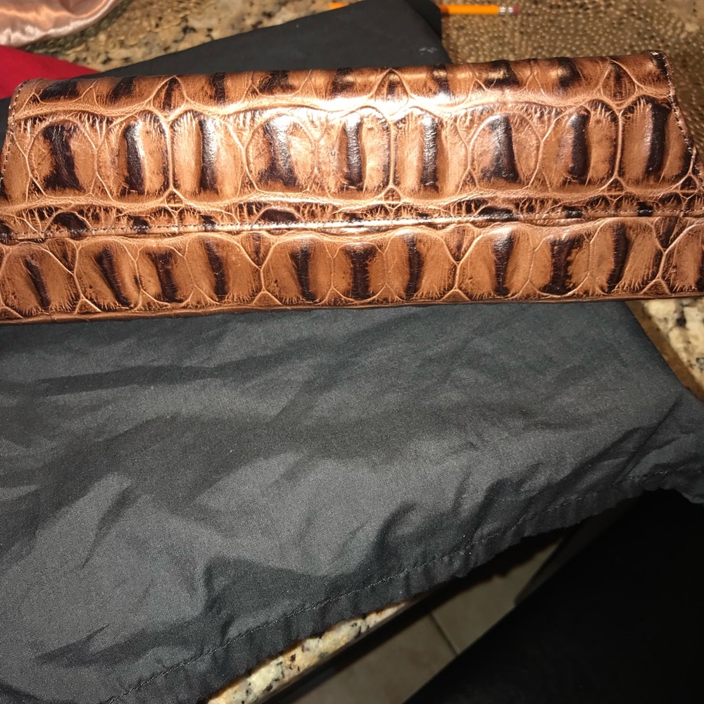 Ladies brown crocodile effect clutch.